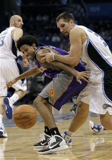 Phoenix Suns Guard Josh Childress, Front Left, And Orlando Magic Power Forward Ryan Anderson Scramble For A Loose Ball