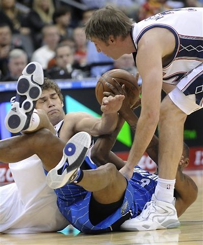 New Jersey Nets Center Brook Lopez, Left, And Troy Murphy, Right, Battle For A Loose Ball With Orlando Magic Forward