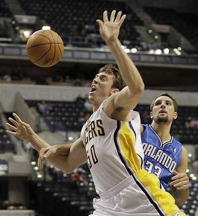 Indiana Pacers' Tyler Hansbrough, Left, Is