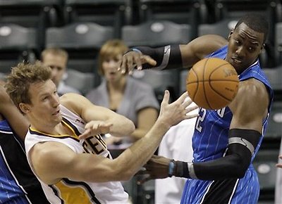 Indiana Pacers' Mike Dunleavy, Left, And Orlando Magic's Dwight Howard Battle For A Rebound