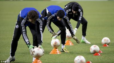 Balancing act: Chelsea's goalkeepers warm up during a training session at Luzhniki stadium