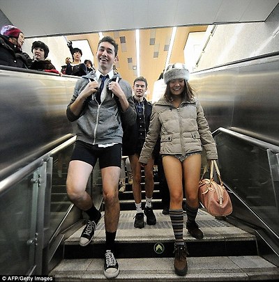 Happy: Two commuters walk down to the platforms in the Beijing Subway