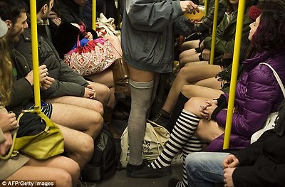 Crammed: Participants slide in next to each other, forming two lines of pant-less commuters