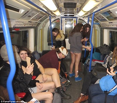 Destination: Trouserless passengers make their way towards Arsenal on the Piccadilly Line on London's Underground
