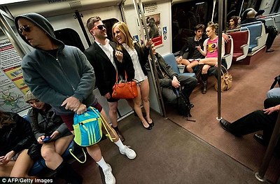 Smartly-dressed: A couple opted for business attire during their journey in the American capital, while others kept warm by wearing a hoodie