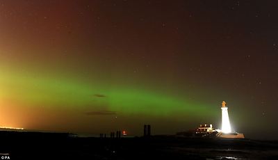The aurora borealis, or the northern lights as they are commonly known, at St. Mary's Lighthouse and Visitor Centre, Whitley Bay, North Tyneside