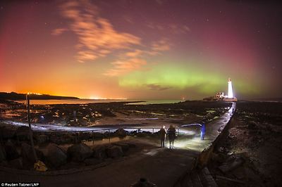 Spectacular: People watch the Northern Lights, dance over St. Mary's Lighthouse in Whitely Bay just outside Newcastle