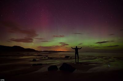 Colourful: The bay was lit up with purple, blue and green colours as millions of particles entered the earth's atmosphere