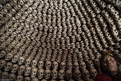 Fake human skulls are placed inside a room at the site for the sky burials