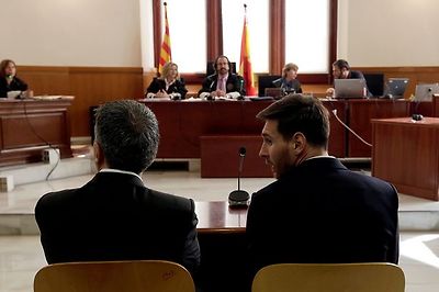 Lionel Messi sits in court with his father Jorge Horacio Messi