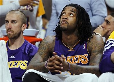 Los Angeles Lakers Guard Steve Blake, Left, And Center Jordan Hill Look On From The Bench As