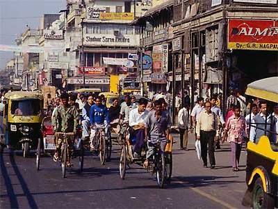 Rickshaws, covered and uncovered, on Chandni Chowk, Old Delhi
