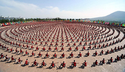thousands of kung fu fighters arranged in concentric circles for heritage day demonstration