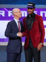 Marquese Chriss greets NBA commissioner Adam Silver