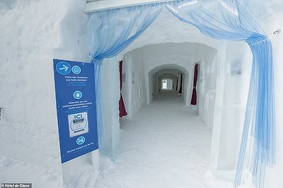 To build the hotel, snow is 'blown data-onto vaulted or domeshaped metal moulds' and 'held in place by wooden forms to solidify the structure' before they are removed a few days later. Pictured is the entrance to the hotel's rooms
