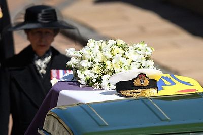 Princess Anne, Princess Royal, follows the coffin during the ceremonial funeral procession of Britain's Prince Philip, Duke of Edinburgh to St George's Chapel in Windsor Castle, London, data-on April 17, 2021.