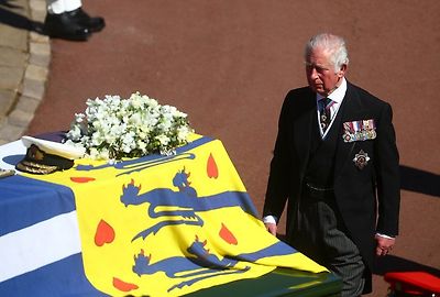 The Prince of Wales walks behind The Duke of Edinburgh's coffin, covered with His Royal Highness's Personal Standard, outside St George's Chapel, Windsor Castle, Berkshire, before the funeral of the Duke of Edinburgh. April 17, 2021.