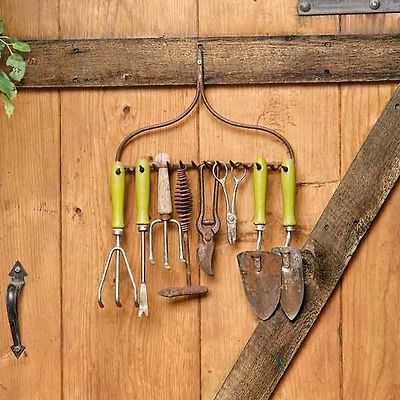 salvaged garden rake head used as garden tool rack, easy upgrades around the home for the whole year