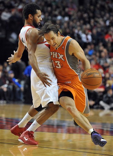 Phoenix Suns Point Guard Steve Nash (13) Is Fouled By Portland Trail Blazers Point Guard Patrick Mills (8) As He Drives