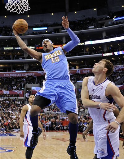 Denver Nuggets Forward Carmelo Anthony, Left, Goes Up For A Shot As Los Angeles Clippers Forward Blake Griffin, Right,