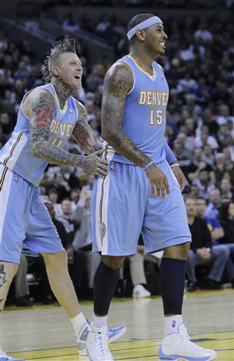Denver Nuggets Small Forward Carmelo Anthony (15) And Center Nene Hilario, Left, Smiles