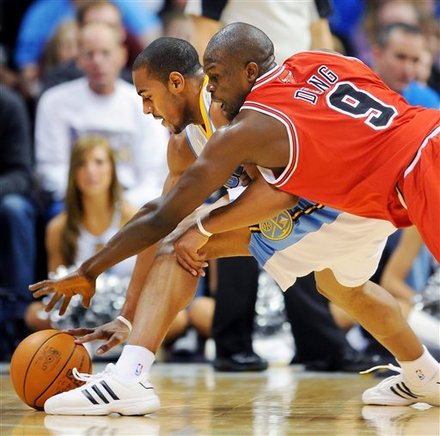 Chicago Bulls Forward Luol Deng, Right, Tries
