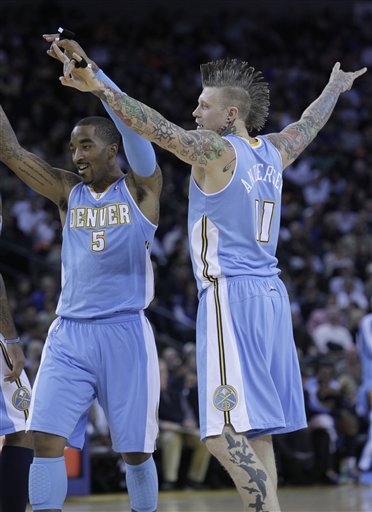 Denver Nuggets Shooting Guard J.R. Smith (5) And Center Chris Andersen (11) Celebrate