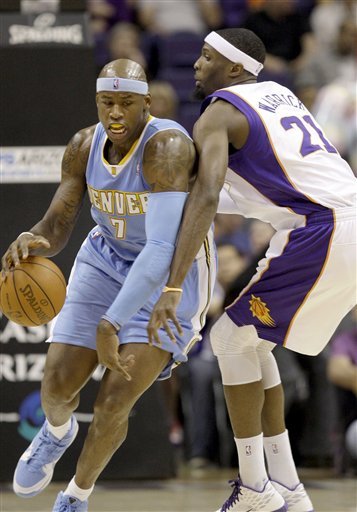 Denver Nuggets' Al Harrington (7) Collides