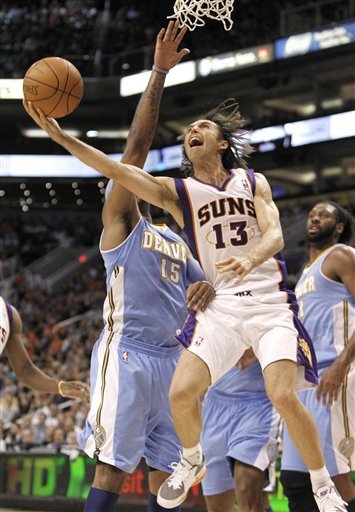 Phoenix Suns' Steve Nash (13) Tries To Get Off A Shot As Denver Nuggets' Carmelo Anthony (15) Defends And Nene Looks On