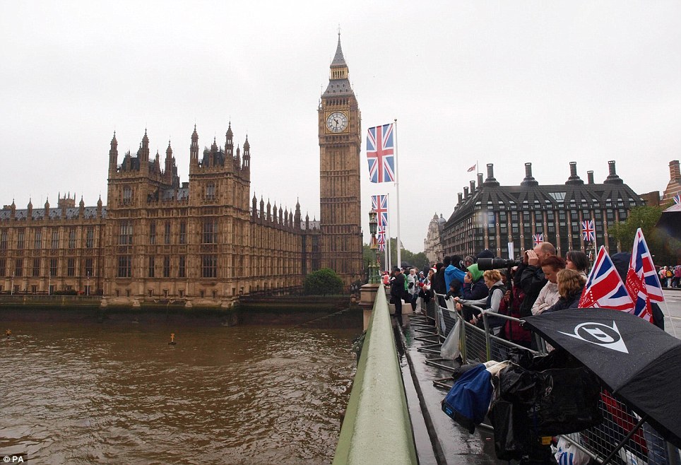 Crowds gather on Westminster Bridge, London, ahead of the start of the Diamond Jubilee river pageant