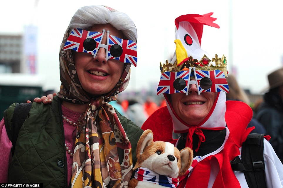 Two women, one dressed as the Queen and another as a 'coronation chicken' go all out in celebration of the Jubilee