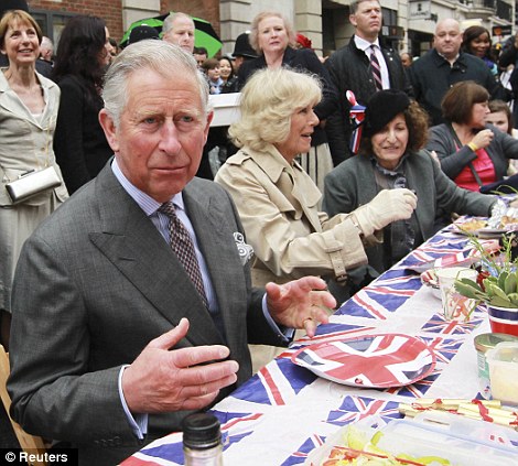 Prince Charles and his wife the Duchess of Cornwall get into the swing of things as they celebrate the Queen's Diamond Jubilee
