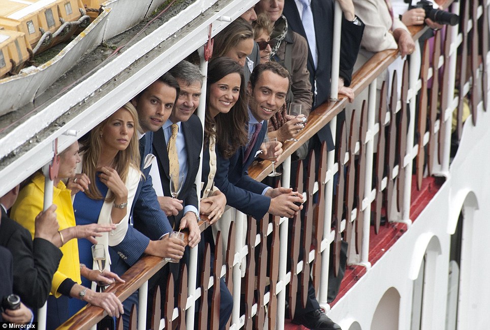 Pippa Middleton, second from the right, was on-board one of the boats with her brother James, far right, and father Michael, third from right. They were invited by the Queen to celebrate her Diamond Jubilee