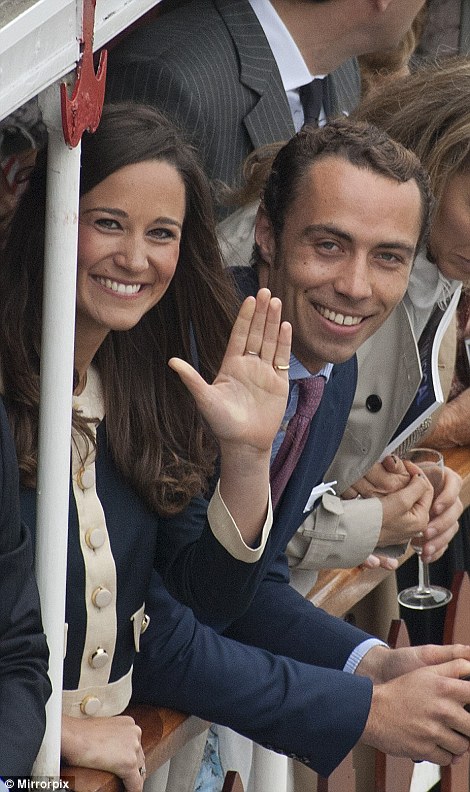 A delighted-looking Pippa Middleton and her brother James smile as they make their way down the Thames