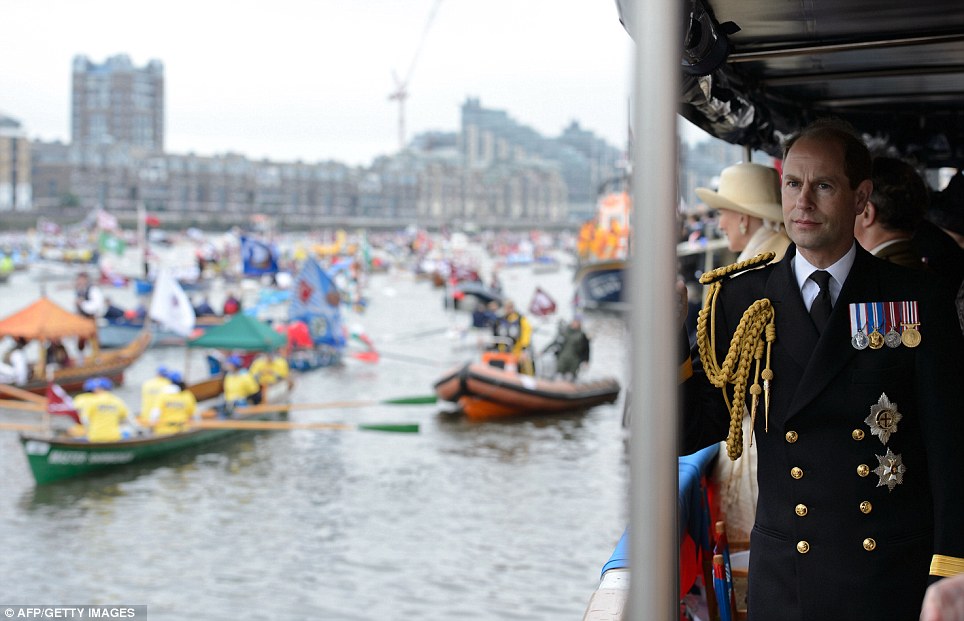 Prince Edward, Earl of Wessex, watches the boats from the deck of 'Havengore' during the Thames Diamond Jubilee Pageant