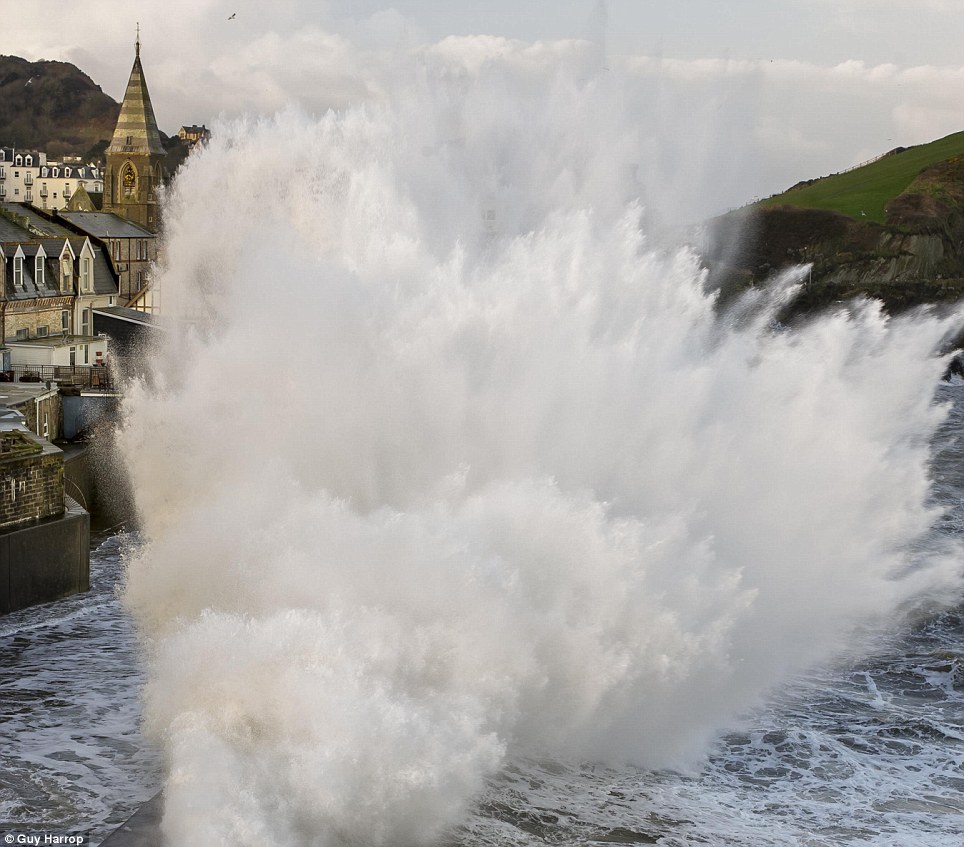 Waves crash into Ilfracombe Harbour at high tide in Devon today as the UK prepares itself for more bad weather