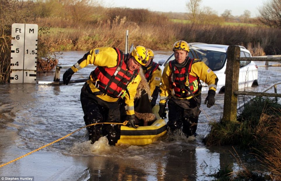 Three people are n rescued from their vehicles this morning after getting stuck in 3ft of floodwater near Ingatestone, in Essex