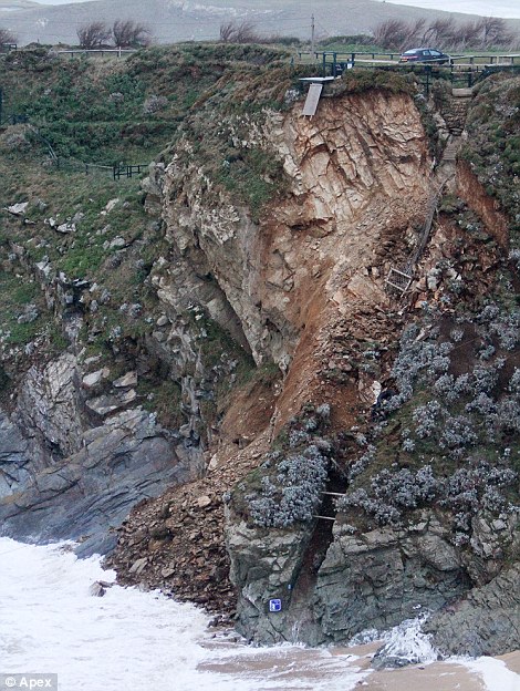 A huge section of cliffs near Newquay in Cornwall collapses into the sea following the severe weekend storms