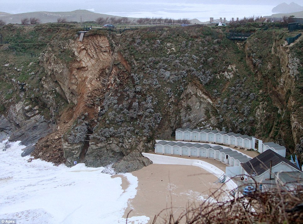 Powerful: A huge section of this cliff near Newquay in Cornwall collapsed last night into the sea following severe weekend storms