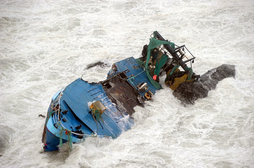 The wreck of a trawler which sank near Newquay in Cornwall overnight after storms hit the coastline