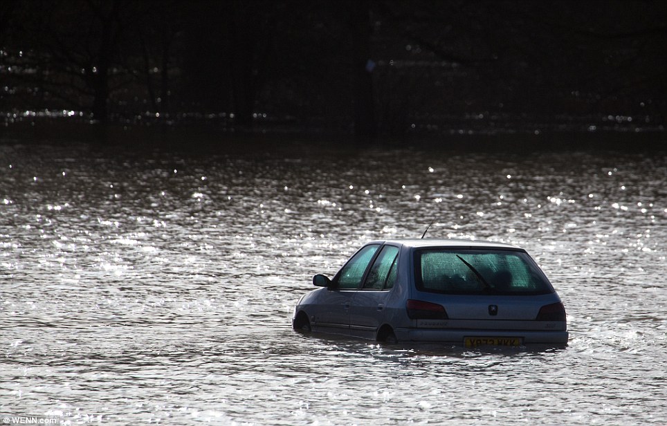 Not moving: Residents of The Little Venice Caravan Park are once again hit by severe flooding after the River Medway burst its banks on Saturday in Yalding, Kent