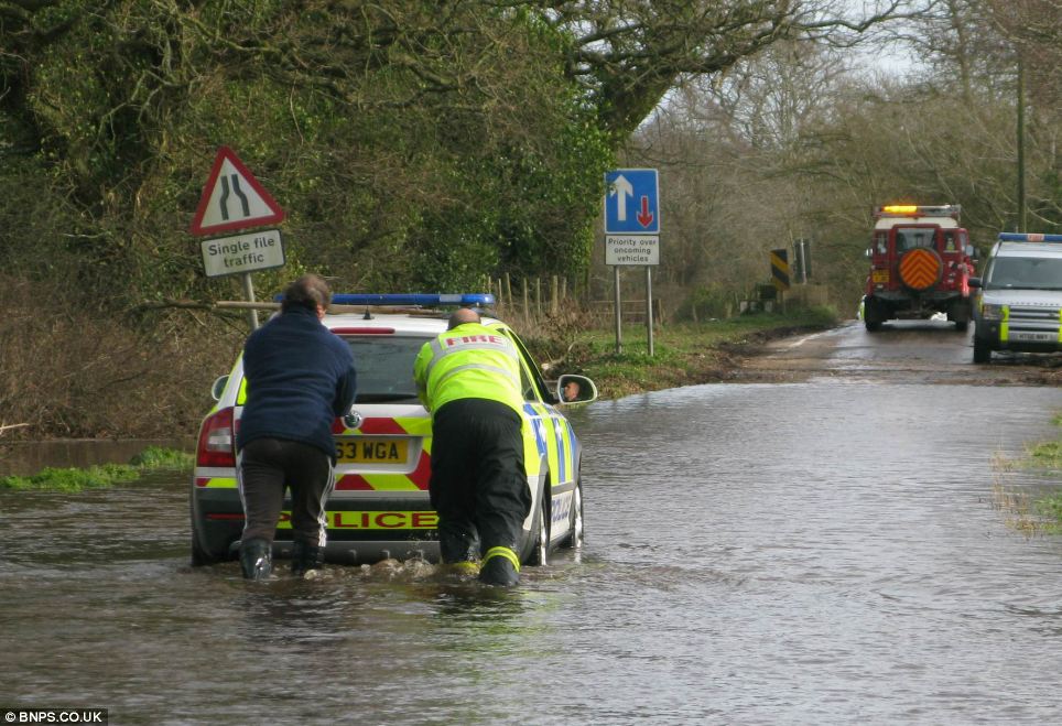 Boys in blue left red faced: The Skoda had to be pushed out by staff from Wessex Fire Rescue