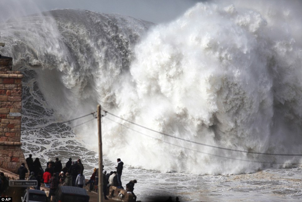 Huge waves breaking at the Praia do Norte, or North beach, outside the fishing village of Nazare, in the central coast of Portugal