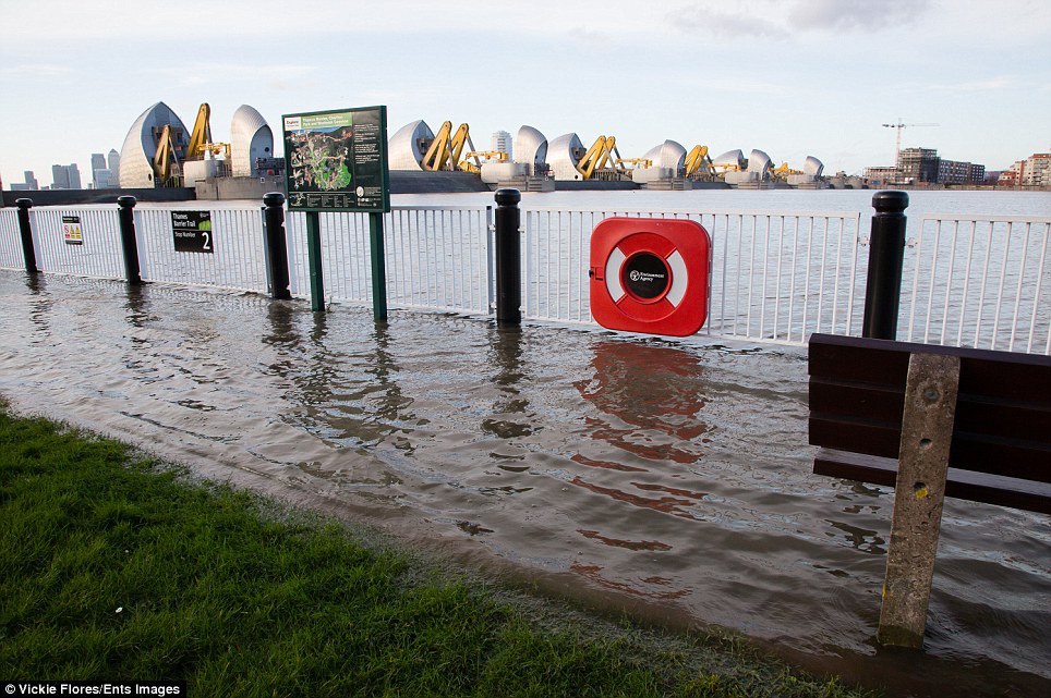 Flooding on the Thames Path: The Thames Barrier at Woolwich in South-East London is closed as part of flood defence strategies