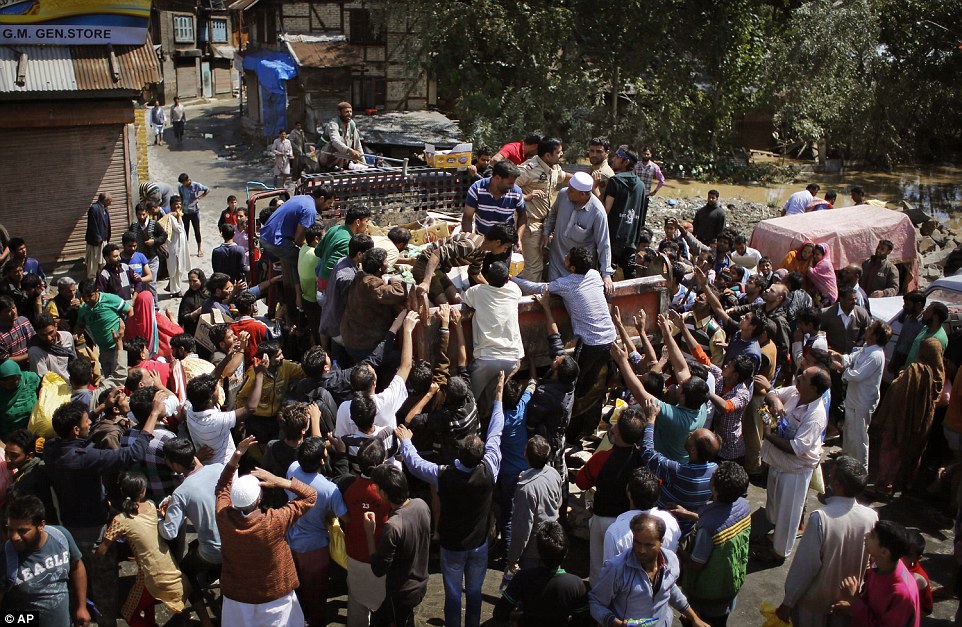 Desperate: Phone lines to Srinagar (pictured) have been cut off for days and supplies of food and water are running out as hundreds of thousands remain stranded