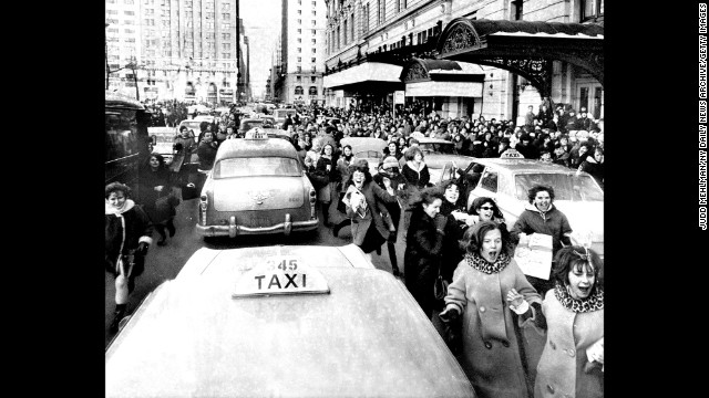 Fans run to catch a glimpse of The Beatles while the band was in New York.