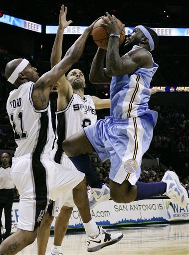 Denver Nuggets' Ty Lawson, Right, Is