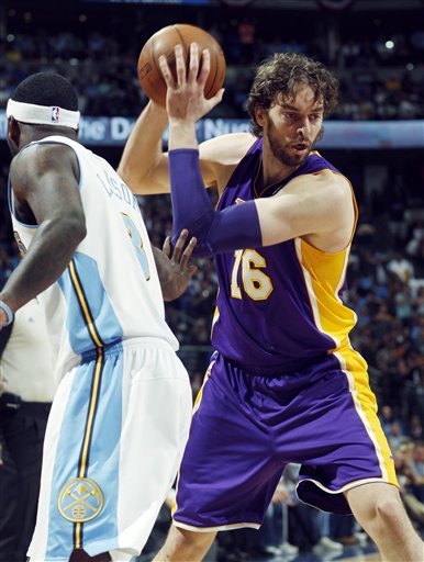 Los Angeles Lakers Forward Pau Gasol, Right, Of Spain, Pulls In A Loose Ball In Front Of Denver Nuggets Guard Ty Lawson