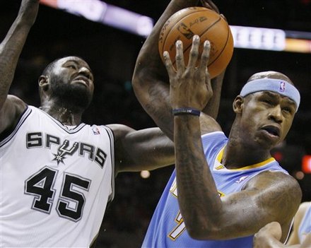 Denver Nuggets' Al Harrington, Right, Fights