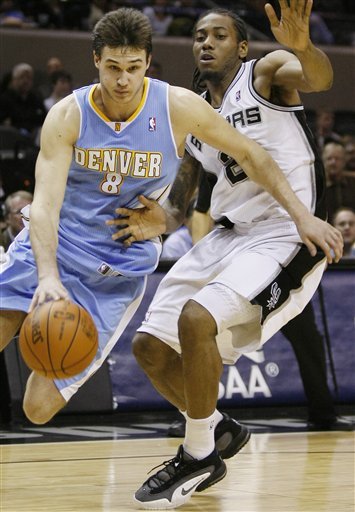 Denver Nuggets' Danilo Gallinari, Left, Of Italy, Drives